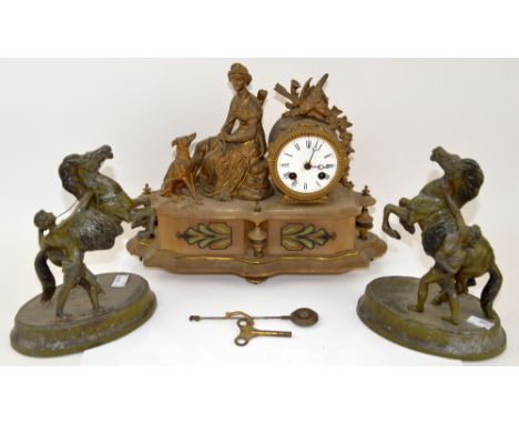 Early 20th Century French onyx mantel clock surmounted with a seated figure of Diana, together with a pair of spelter Marley 