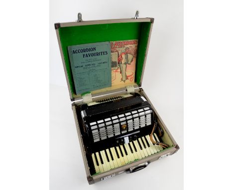 A Parrot accordion in fitted case.  
