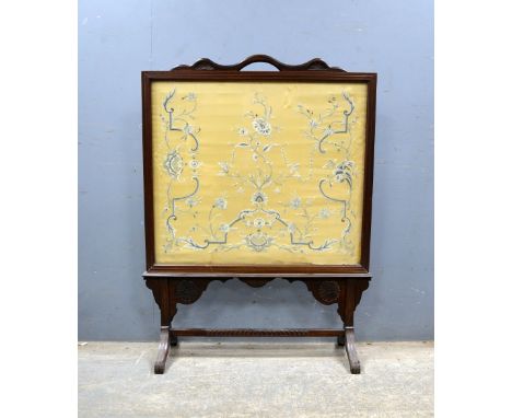 Edwardian mahogany firescreen inset with a floral silkwork panel, height 106cmProvenance - Removed for sale from Runnymede Pa