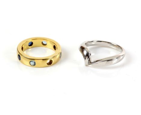 Two modern rings, one set with round cut sapphires and aquamarines, ring size K and white gold twist, size M, both in 18 ct g