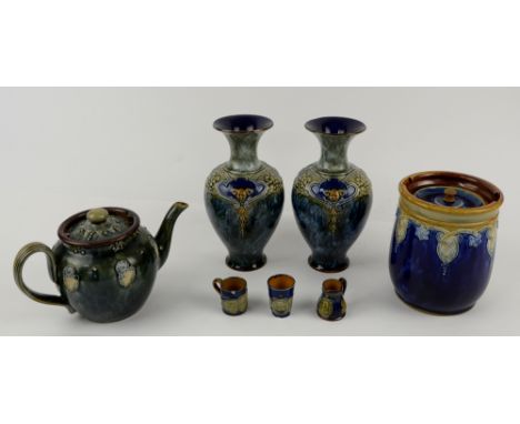 Pair of Royal Doulton stoneware vases with mask decoration, biscuit barrel, teapot, and three miniature Nelson commemorative 