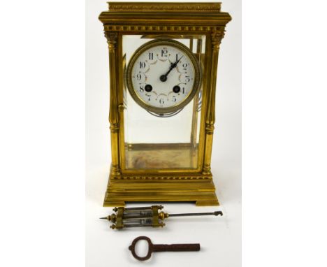 French gilt metal mantel clock with, the white enamelled dial with floral decoration, and mercury pendulum,.  