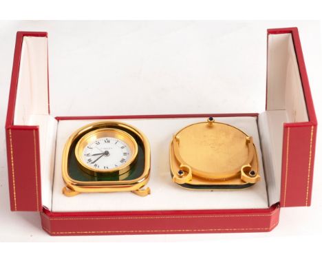 A Cartier alarm clock, 8cm high and a picture frame en-suite, in original box
