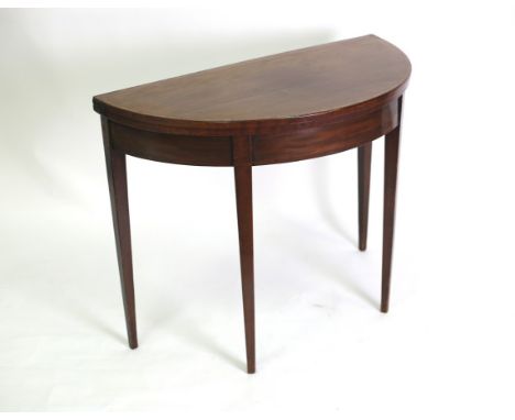 A George III mahogany and crossbanded half-round card table on square tapering legs, 91cm wide