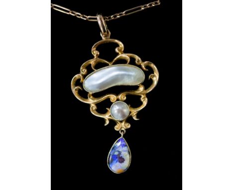 An Art Nouveau 15ct gold pendant of openwork form set with mother-of-pearl and an opal drop on a 9ct gold fetter and three ty