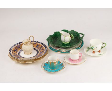 A group of English ceramics decorated with flowers and leaves, comprising five plates, three cups and saucers and two jugs CO