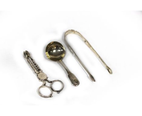 A pair of George III bright cut silver sugar nips, Hester Bateman, no date letter, a George IV caddy spoon, London 1825 and a