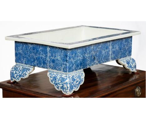 A Japanese blue and white jardiniere, of rectangular form on ogee bracket feet, 57cm wide CONDITION REPORT: One corner has br