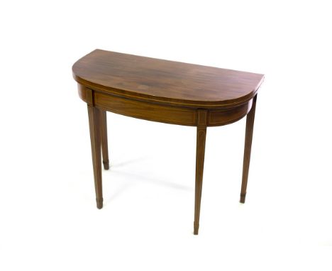 A George III mahogany fold-over card table, with boxwood stringing on square tapering legs, 91cm wide