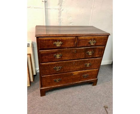 A George III oak chest of two short and three long drawers, on bracket feet, 93cm wide CONDITION REPORT: There are restoratio