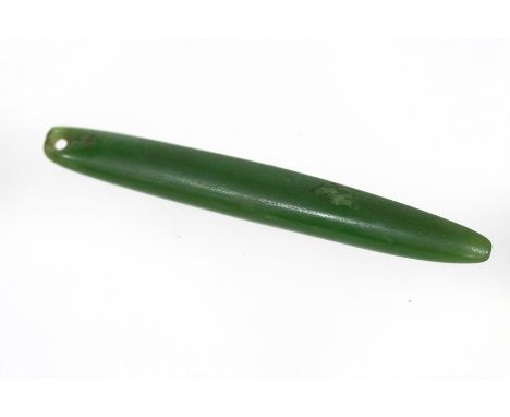 A 19th Century Maori nephrite jade ear pendant (pounamu), of elongated oval form, pierced for suspension, 10.5cm long CONDITI