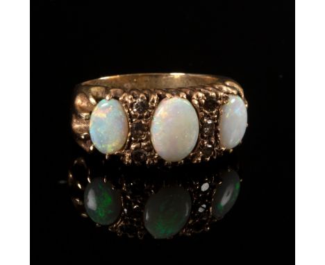 An opal and diamond ring, the three oval opals interspersed by rose cut diamonds, size M CONDITION REPORT: Unhallmarked, beli