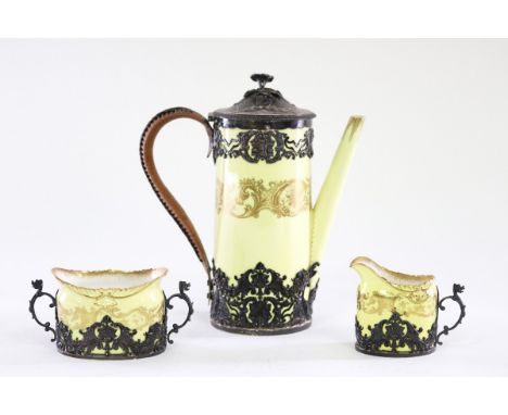 A Royal Worcester silver mounted coffee pot, sugar basin and cream jug, the mounts Adie Bros., London 1894 CONDITION REPORT: 
