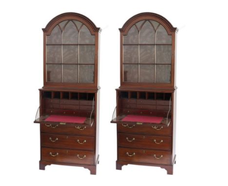 A pair of George III mahogany secretaire bookcases, circa 1770, each with dome topped dentil cornice above glazed door and a 