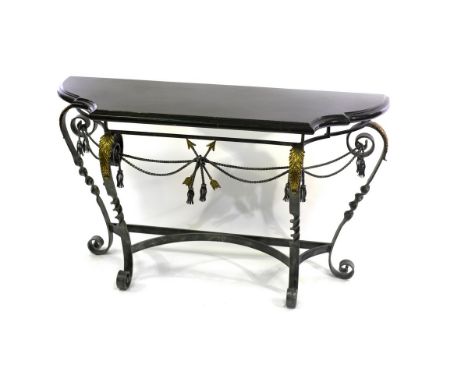 A decorative marble topped console table, designed by Maitland Smith, the metalwork base on brass leaf-capped scroll legs, 13