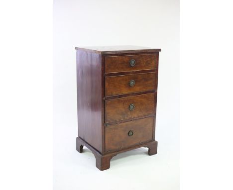 A narrow mahogany chest of four drawers, on bracket feet, 53cm wide