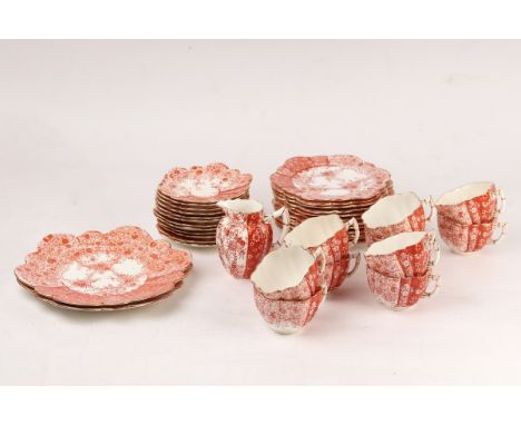 A Wileman & Co part tea service, circa 1900, printed in red in the Aesthetic style, comprising milk jug, two cake plates, ele