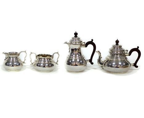 A silver tea and coffee service, Richard Comyns, London 1969, of circular shape comprising teapot, coffee pot, sugar basin an