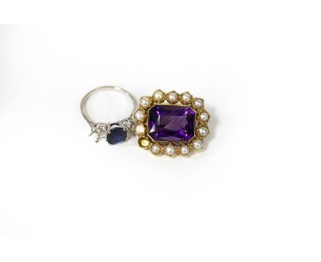 A sapphire ring, formerly a three-stone but with flanking stones removed and an amethyst and split pearl brooch (two pearls m