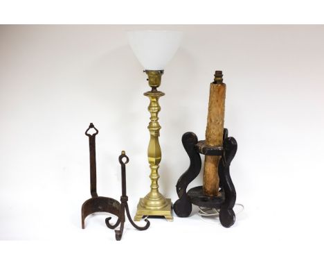 An unusual Spanish candlestick, converted for electricity, two wrought iron lamp bases and a brass lamp (4)