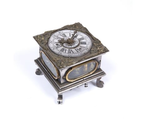 A 16TH CENTURY STYLE SILVERED GERMAN TABLE CLOCK with cherub spandrels and engraved dial with roman numerals and alarm, the f