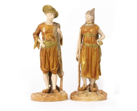 A PAIR OF VICTORIAN WORCESTER BLUSH IVORY FIGURINES depicting a Turkish gentleman and his wife, both with puce mark beneath a