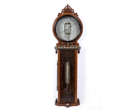 A LATE VICTORIAN OAK CASED 'JOSEPH DAVIS &amp; CO' AMERICAN FORECAST BAROMETER with fretwork crest, circular dial with silver