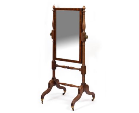 AN EARLY 19TH CENTURY MAHOGANY CHEVAL MIRROR  with cushion moulded frame to the rectangular mirror plate, the turned support 