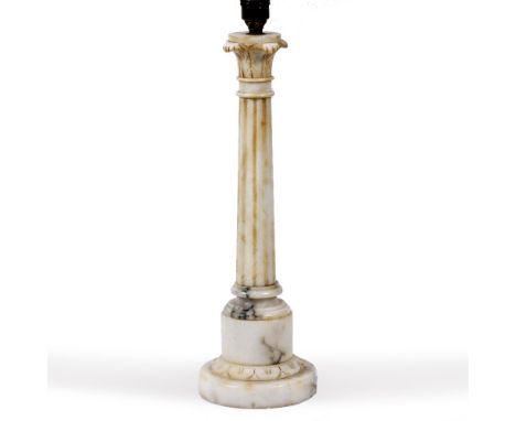 A TURNED ALABASTER TABLE LAMP of fluted classical column form, the base 12cm diameter and the lamp 45.5cm high to the top of 