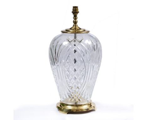 A WATERFORD CUT GLASS AND BRASS MOUNTED TABLE LAMP of inverted baluster form, 22cm diameter x 47cm high to the top of the fit