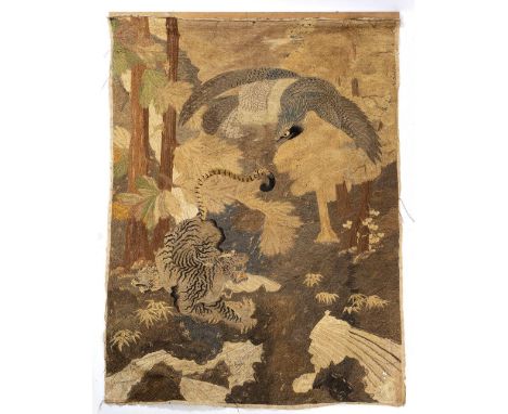 AN ANTIQUE JAPANESE WOVEN PANEL depicting an eagle flying over three tigers in a forest, 136cm wide x 194cm high