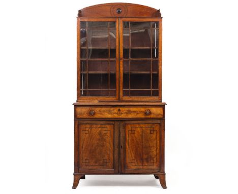 A REGENCY MAHOGANY SECRETAIRE BOOKCASE the arching top over twin astragal glazed doors with two adjustable shelves, the secre