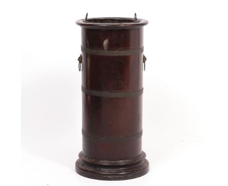 A TURNED MAHOGANY BRASS BOUND CYLINDRICAL STICK STAND with tin liner and lion mask ring handles, 30cm diameter x 62cm high