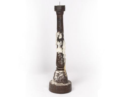 A TURNED AND CARVED HARDWOOD PRICKET CANDLESTICK 17cm diameter at the base x 63cm high