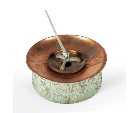 A CAST GREEN PATTERNATED METAL AND COPPER GARDEN SUNDIAL by Swedish designer Sune Rooth, the copper bowl with central gnomon 