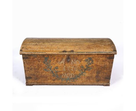 A LARGE CONTINENTAL PAINTED PINE DOME TOP TRUNK with iron bound corners and carrying handles to the end, 124.5cm wide x 58cm 