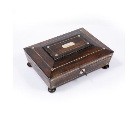 A REGENCY ROSEWOOD WORKBOX of sarcophagus form with pewter and mother of pearl inlay, the interior with paper lining and birc