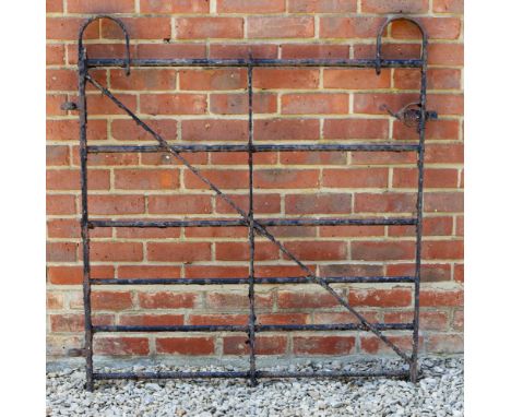 AN OLD BLACK PAINTED WROUGHT IRON GATE, approximately 110cm wide x 117cm high