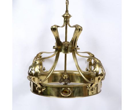 AN ART NOUVEAU BRASS HANGING LIGHT FITTING with scrolling pierced supports and circular ring set with ruskin pottery oval pan