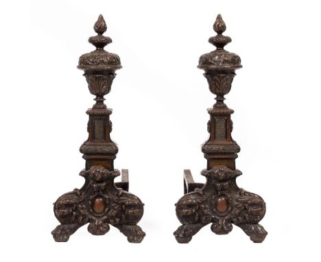 A PAIR OF 17TH CENTURY STYLE BRONZE FIRE DOGS with acanthus leaf cast urns and architectural plinth supports and scrolling fe