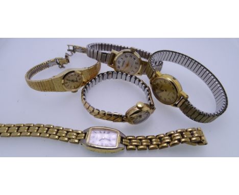 FIVE LADY'S WRISTWATCHES - a yellow metal circular dial wristwatch no. 432247 with incorporated bark bracelet and safety chai