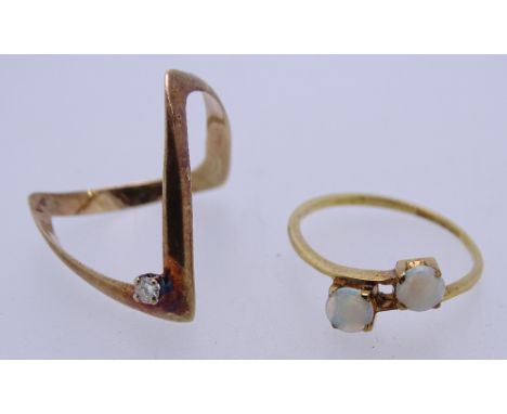 TWO 9CT GOLD DRESS RINGS to include a single diamond set wishbone, size P, the other semi-crossover dual opal setting, 2.4 gr