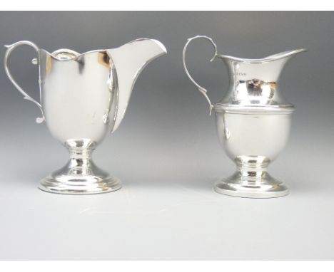 TWO BIRMINGHAM SILVER CREAM JUGS, makers S Blanckensee &amp; Son to include a ewer form on circular foot with scroll handle a