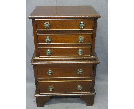 REPRODUCTION MAHOGANY MINI CHEST ON CHEST on corner bracket feet, 67cms H, 43cms max W, 28.5cms max D