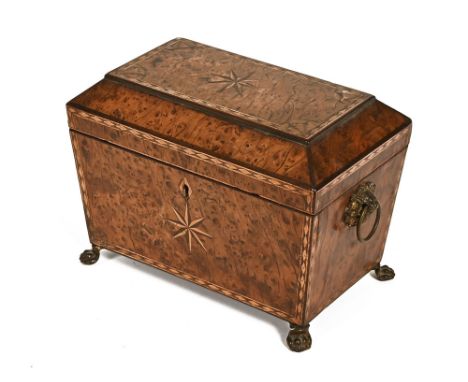 A Georgian burr yew tea caddy, with two interior compartments and raised on pressed metal feet.  Height 15 cm, width 20 cm, d