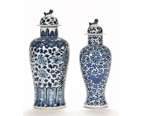A Chinese blue and white baluster lidded vase, of Kangxi style with Dog of Fo finial.  Height 34 cm and a similar 19th centur