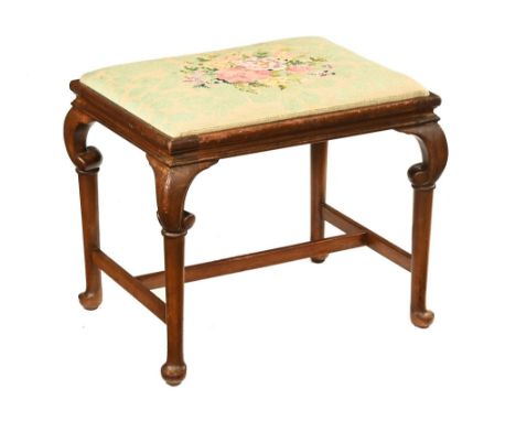 Wylie & Lochhead Ltd an Edwardian rectangular stool, with floral tapestry top raised on turned legs with stretcher, marked to