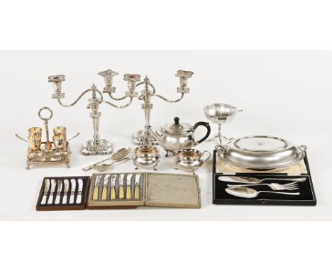 A pair of silver plated candelabra, a plated tea service, entree dish, egg cruet etc.