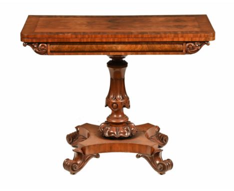 A 19th century mahogany card table, with rectangular hinged top and swivel action raised on a fluted and floral carved column