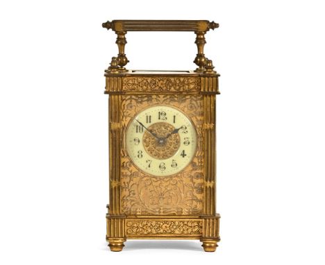 A late 19th century brass carriage clock with circular dial and filigree work to case, timepiece only.  Height excluding carr